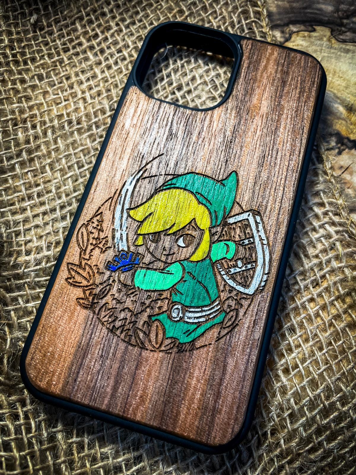a wooden phone case with a picture of a girl on it