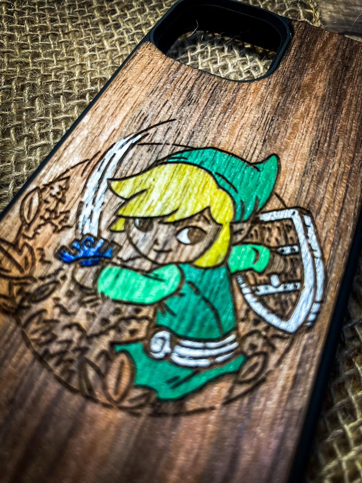 a wooden phone case with a picture of a girl on it