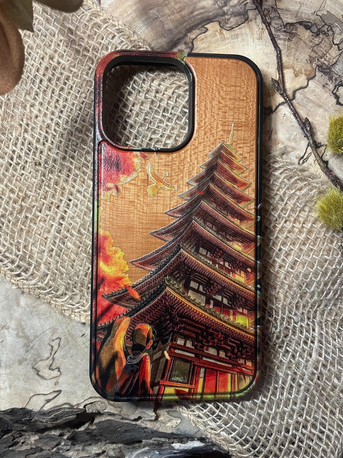 a cell phone case with a painting of a pagoda