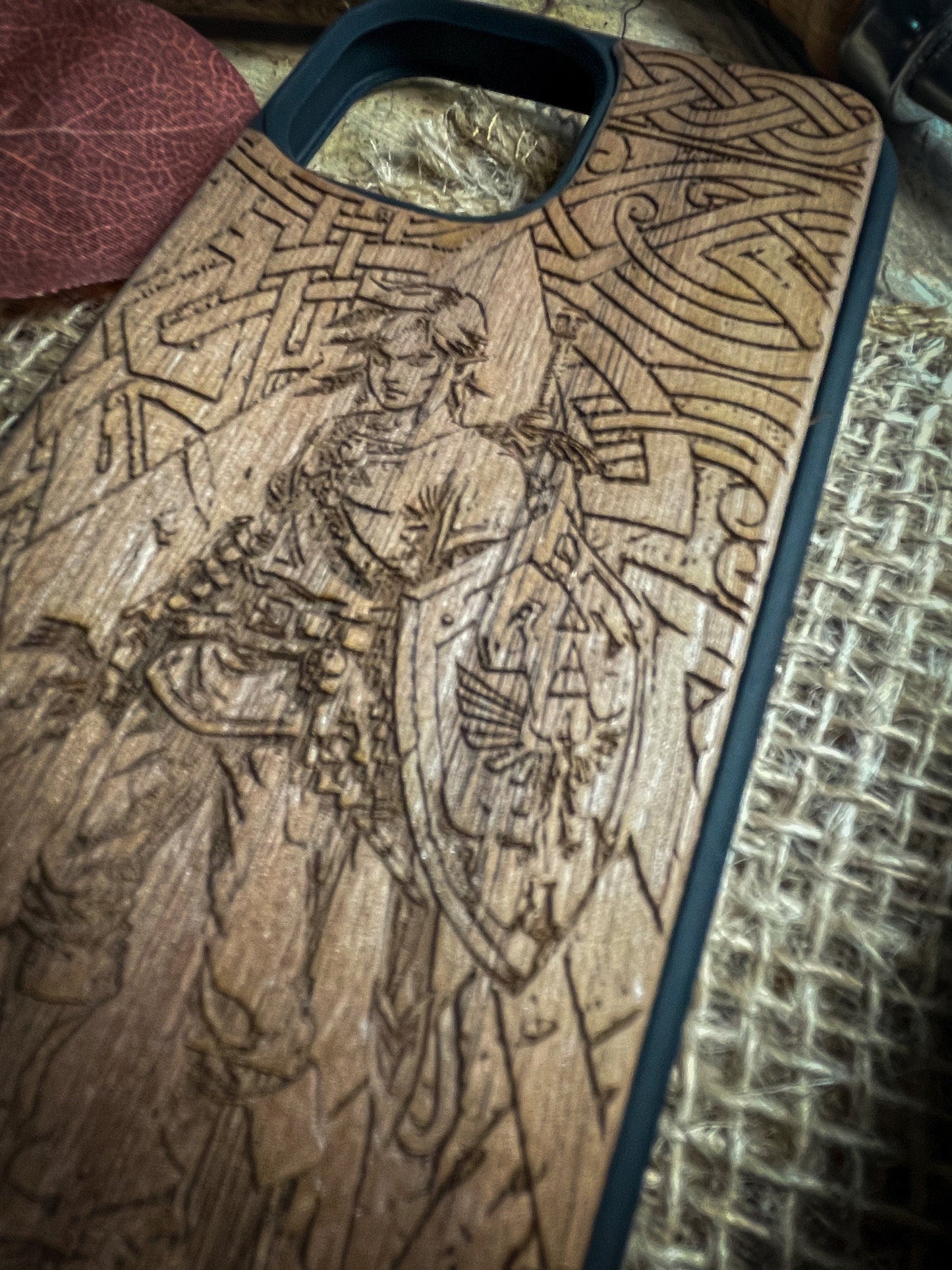 a wooden case sitting on top of a bed