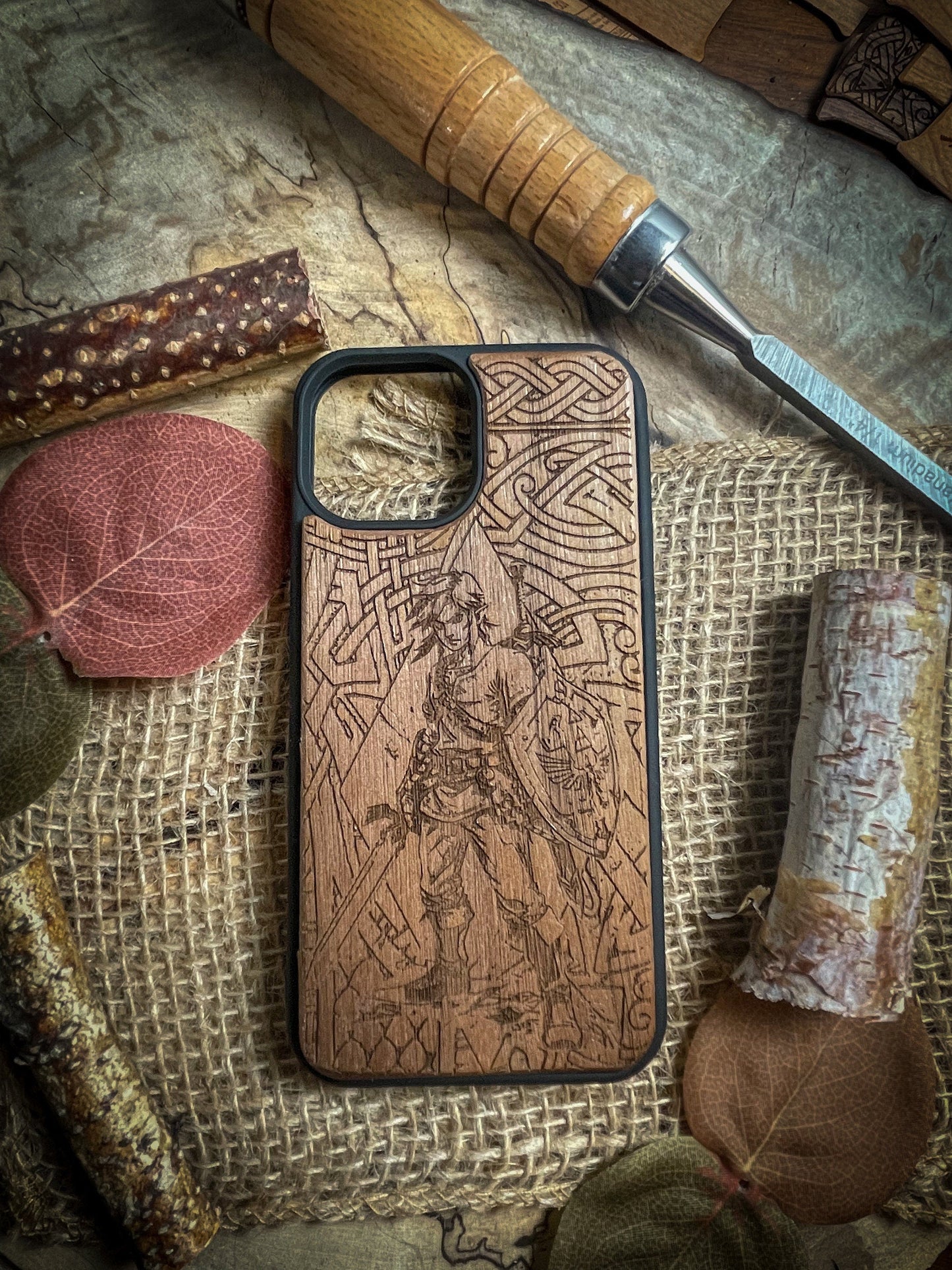 a wooden case sitting on top of a table next to a knife
