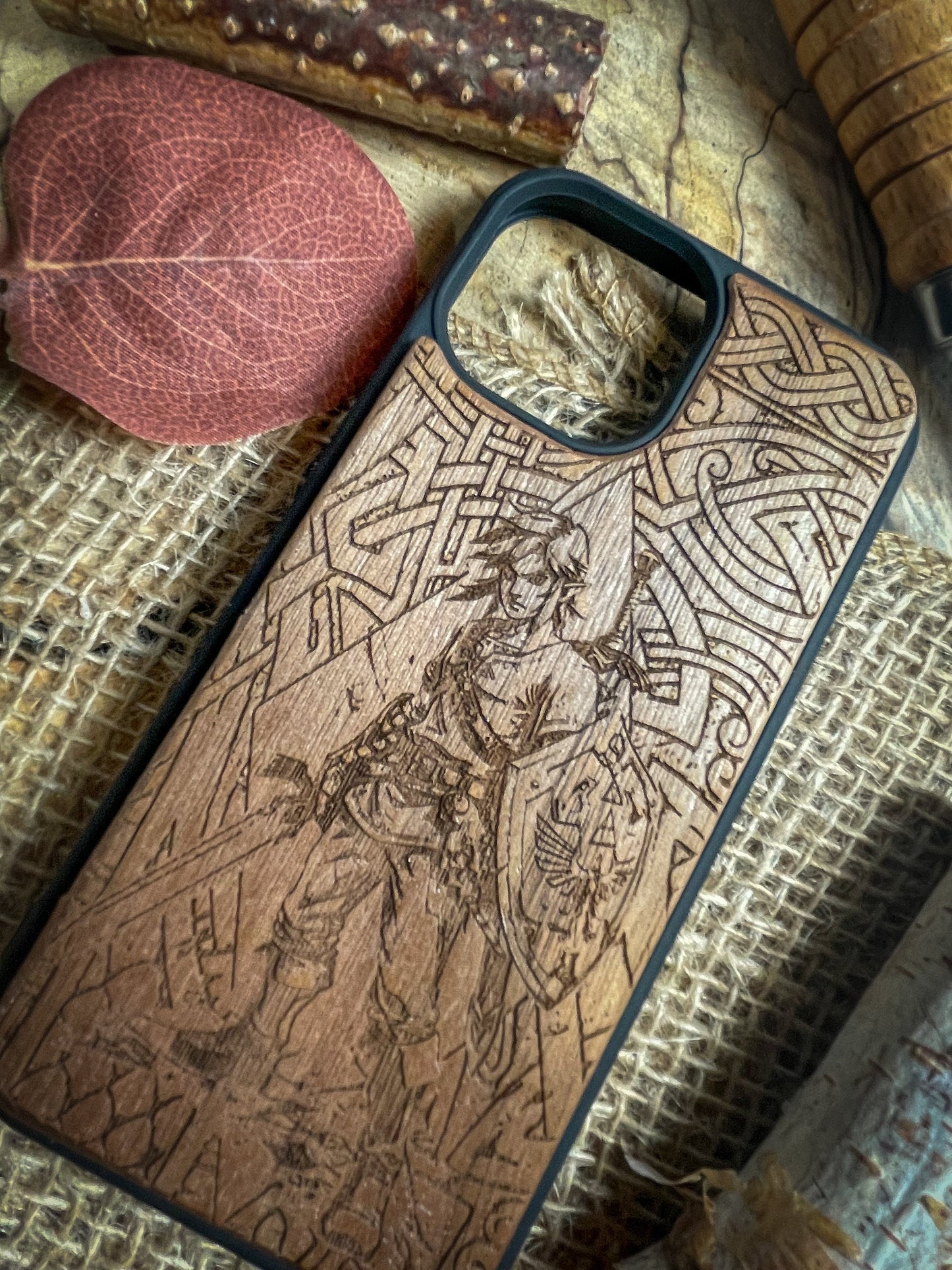 a wooden phone case sitting on top of a table