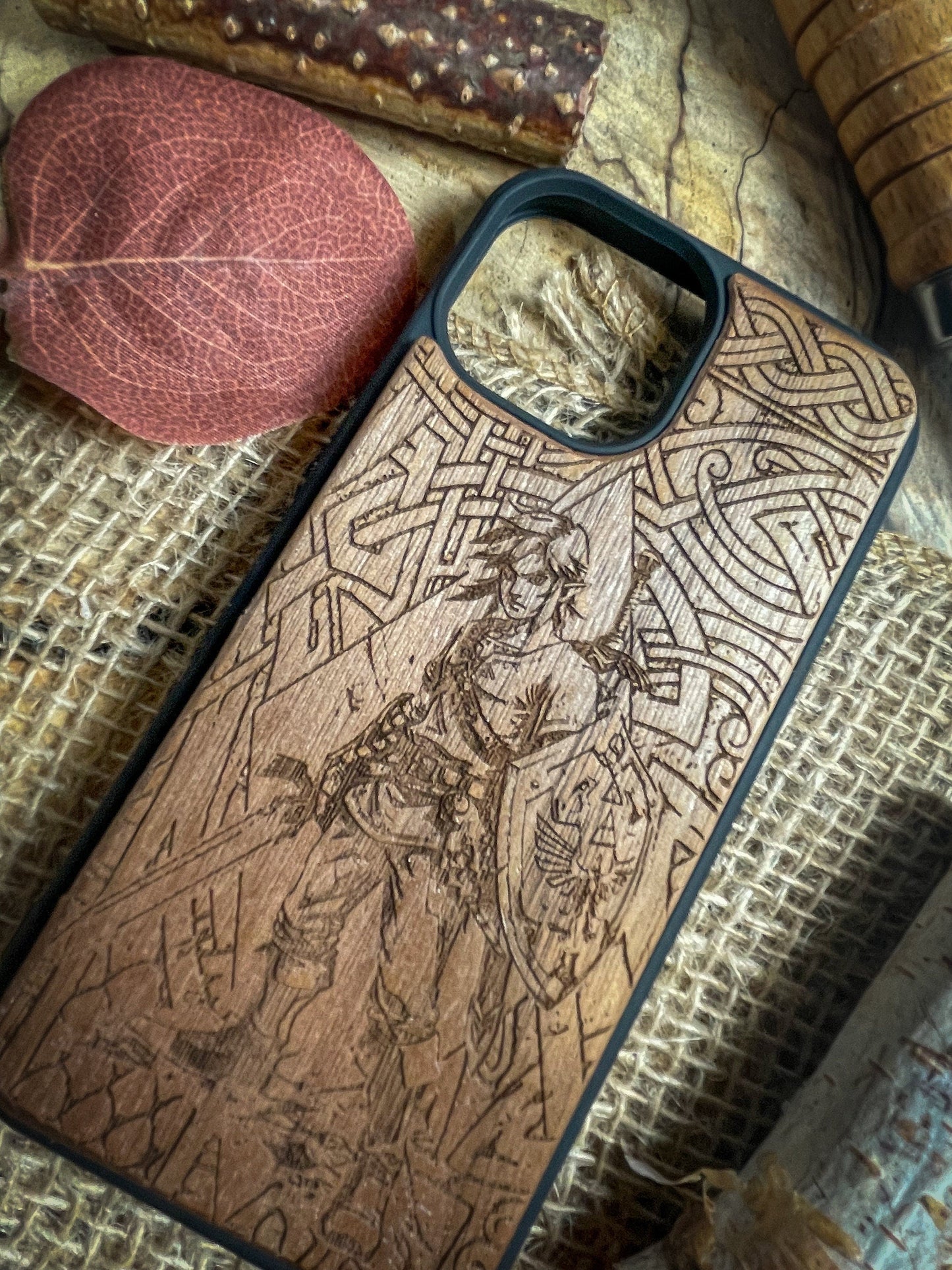 a wooden phone case sitting on top of a table