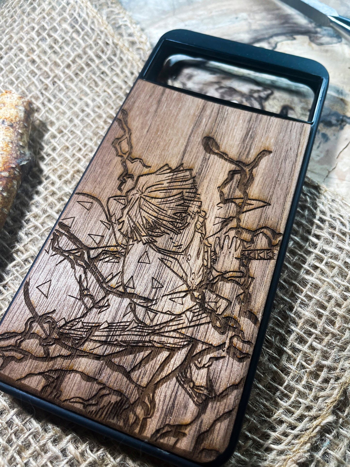 a wooden phone case with a picture of a man on it