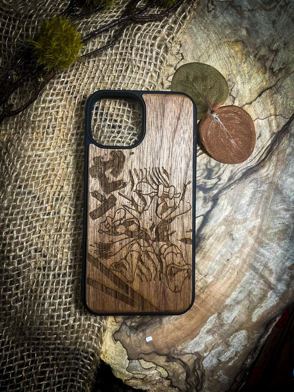 a wooden phone case sitting on top of a table