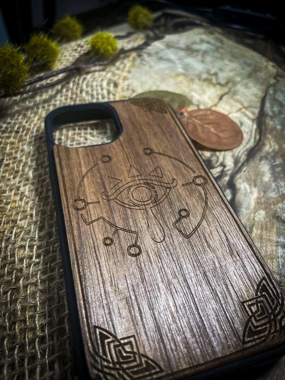 a wooden case sitting on top of a bed