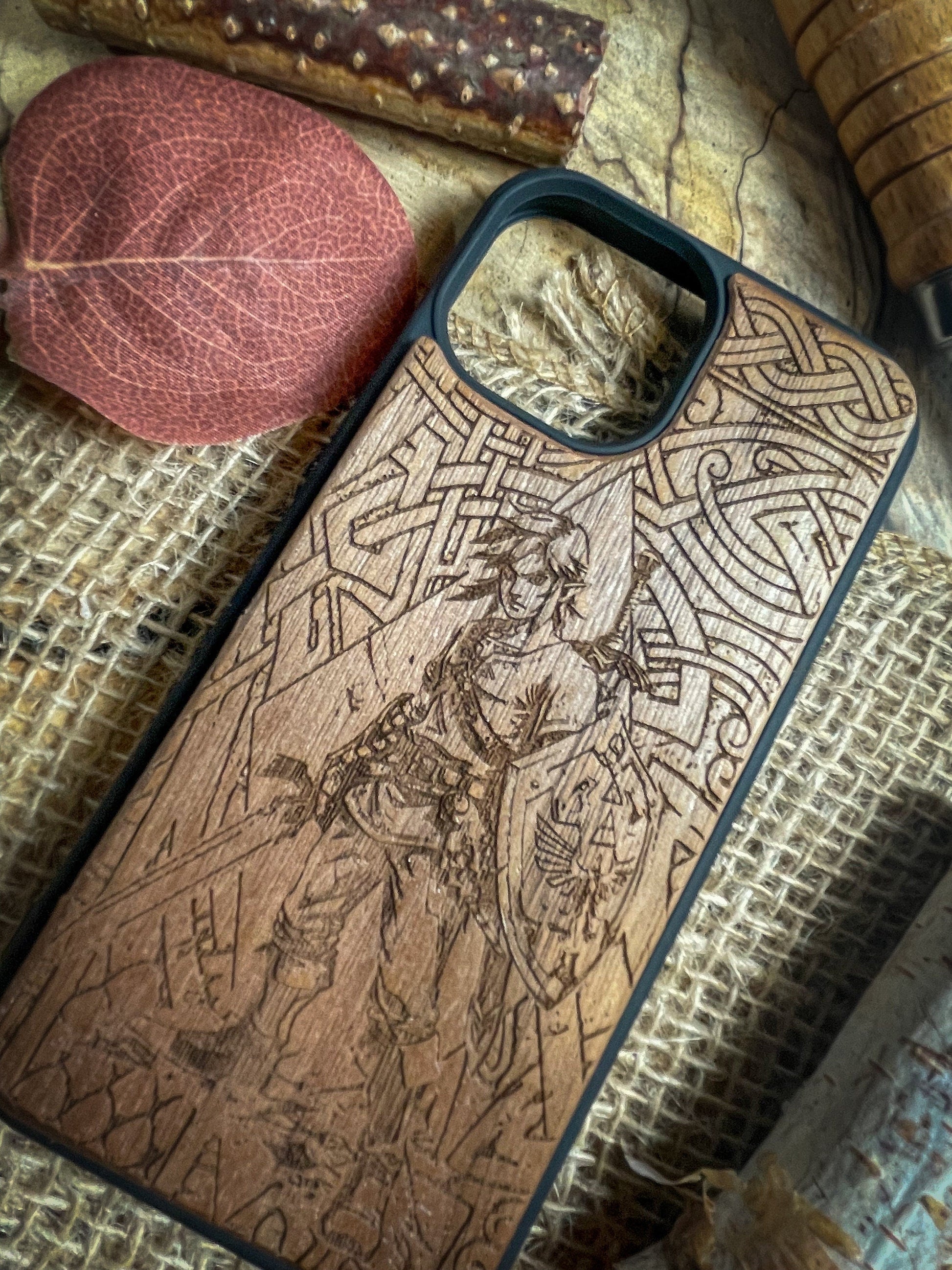 a wooden phone case sitting on top of a table
